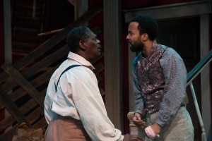As Simon, demanding to know why John (Keith Mascoll) refrained from telling him that his wife and daughter were sold by Mr. DeLeon (PHOTO: Andrew Brilliant)