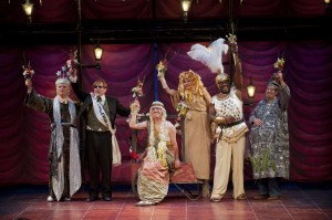 The mechanicals (Malcolm Ingram as Robin Starveling, Jonathan Epstein as Peter Quince, Alexander Sovronsky as Francis Flute, Annette Miller as Snug, Johnny Lee Davenport as Nick Bottom, and Robert Lohbauer as Tom Snout) celebrate, having pleased the king (PHOTO: Kevin Sprague).